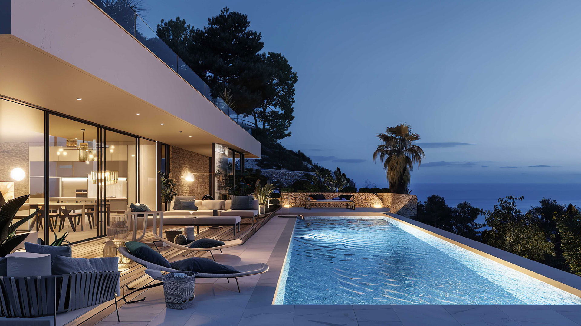 Piscine moderne illuminée en bord de mer la nuit